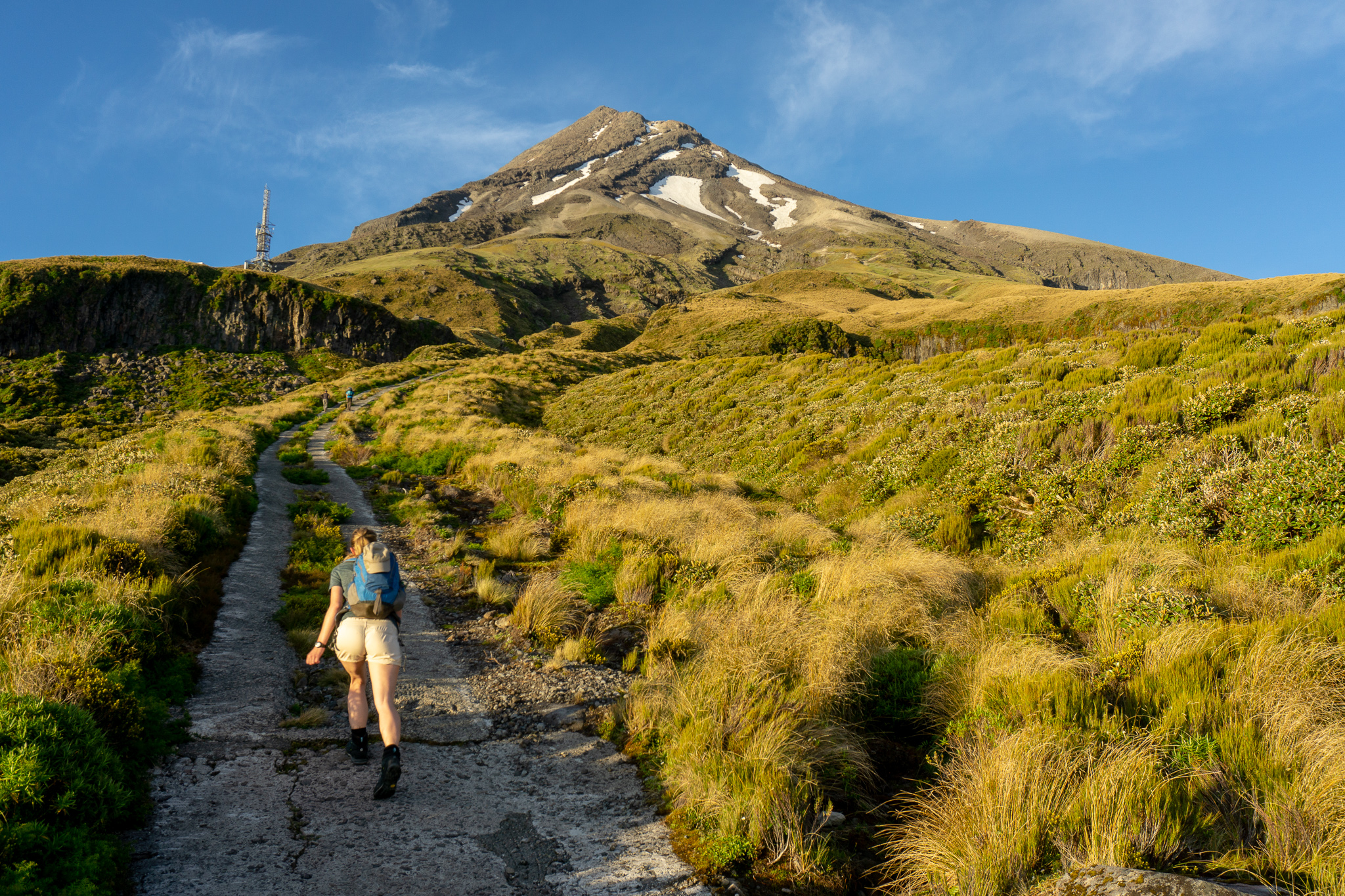 Woman climbing up the Puffer on Mt Taranaki